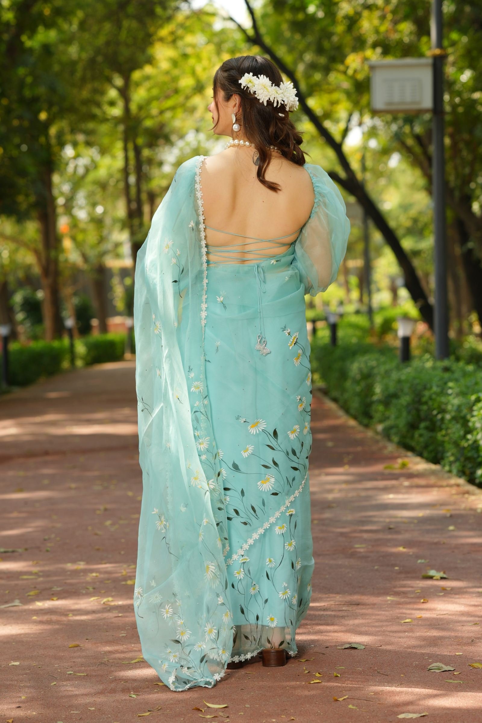 Back view of Azure Daisy Organza Saree, highlighting the scalloped lace border and daisy handpainting detail.