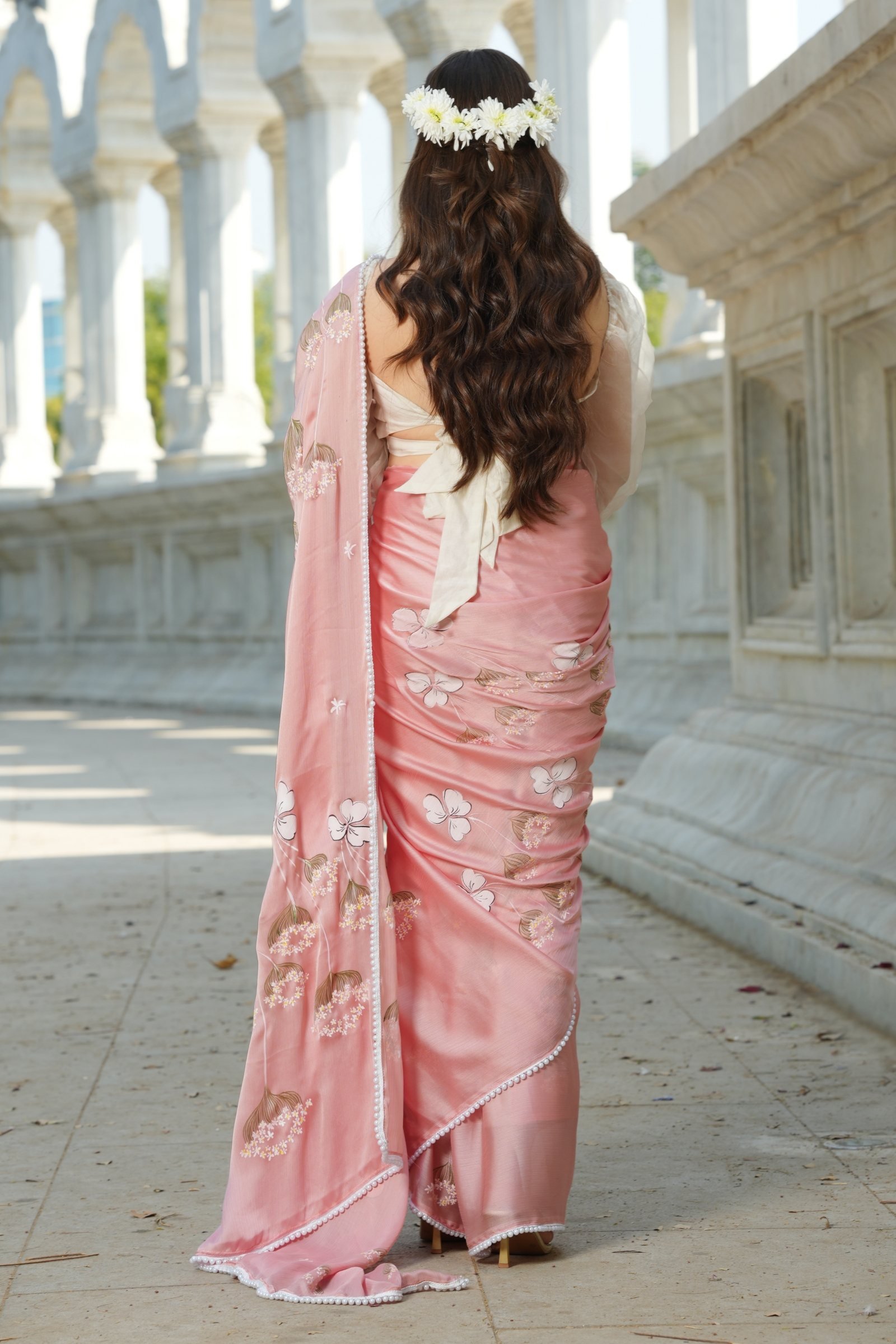 Back view of the Blush Blossom Silk Saree, showcasing the graceful drape and the pearl-beaded scalloped pallu edge.