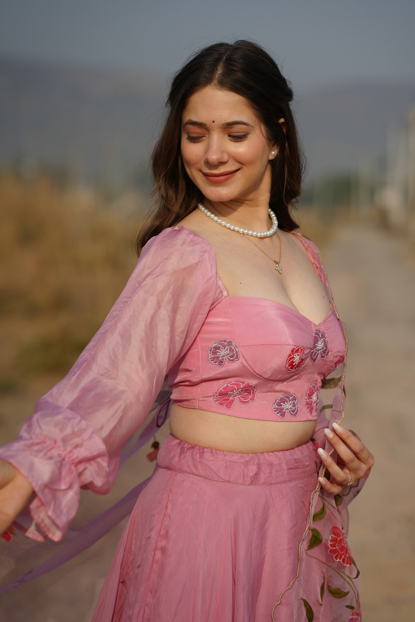 Side View of Pink Silk Lehenga and Ruffled Bishop Sleeves
