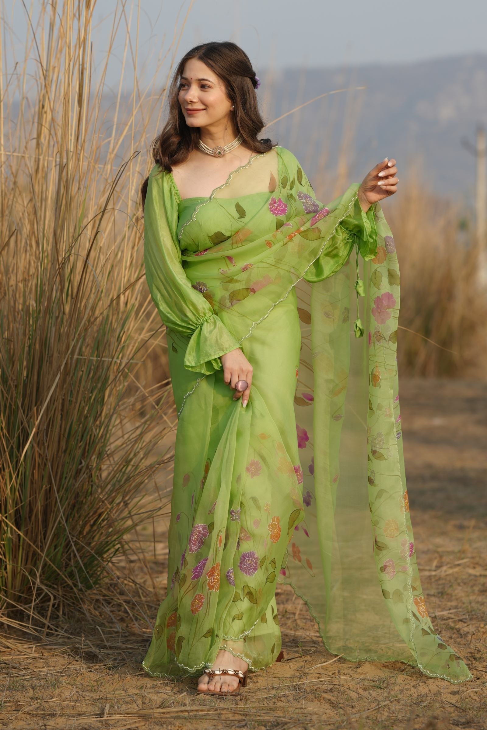 Luxury Handpainted Organza Saree in Lime Green, showcasing vibrant botanical poppy motifs.