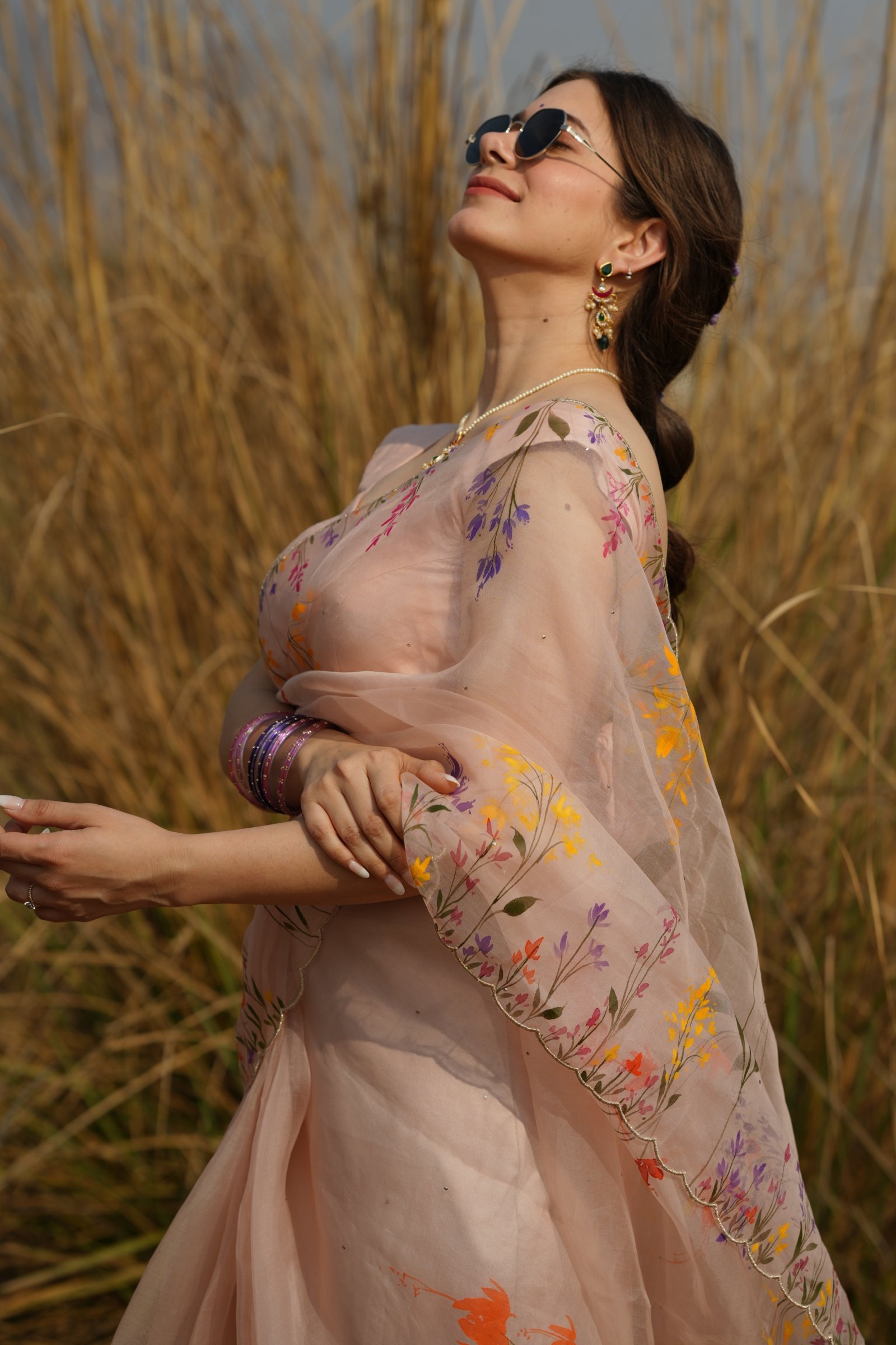 Detailed shot of the dense handpainted wildflower vines on the pure organza silk.