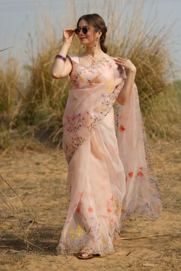 Wildflower Meadow Handpainted Organza Saree in light peach, showcasing colorful wildflower motifs.